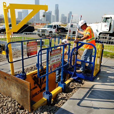 A couple of workers demonstrating ladder safety at National Trench Safety