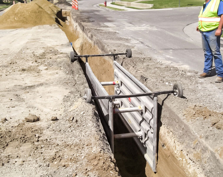 Man-installing-NTS-aluminum-trench-shields Man installing NTS aluminum trench shields