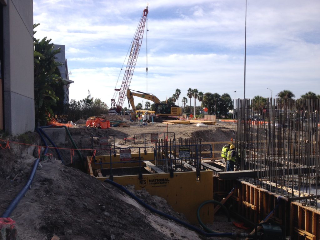 Pier structure foundation pour with three-sided trench shields